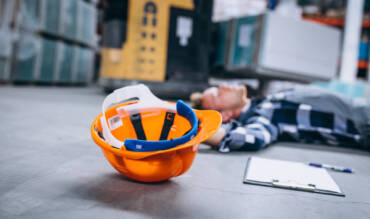 An accident at a warehouse, man on floor